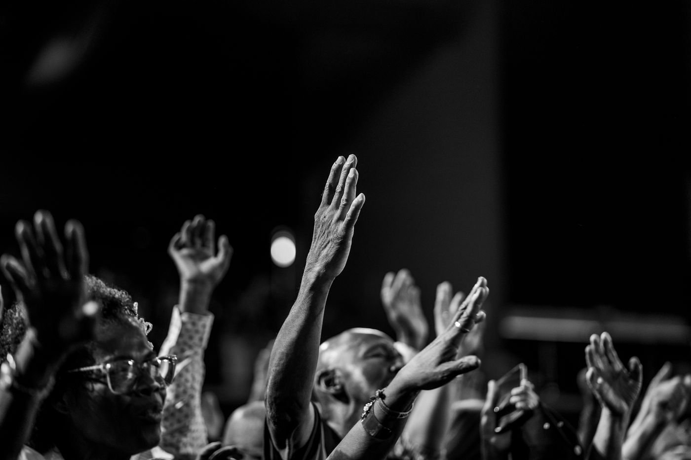 Hands raised together in worship